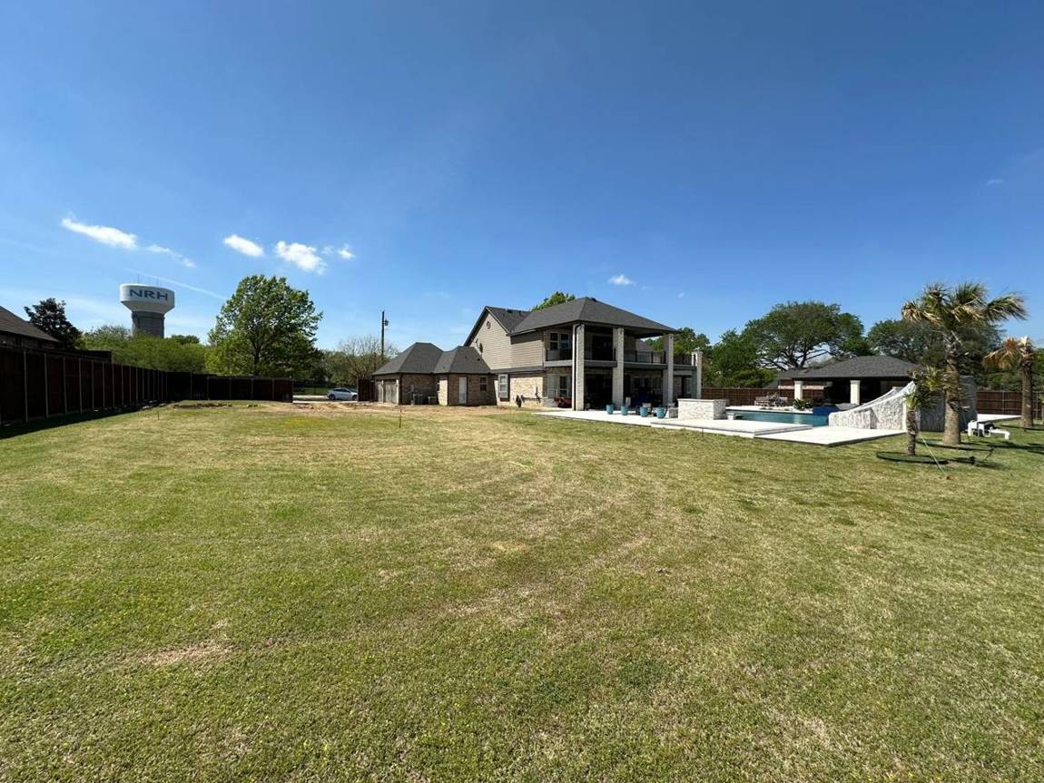 Open lawn beside the house before construction